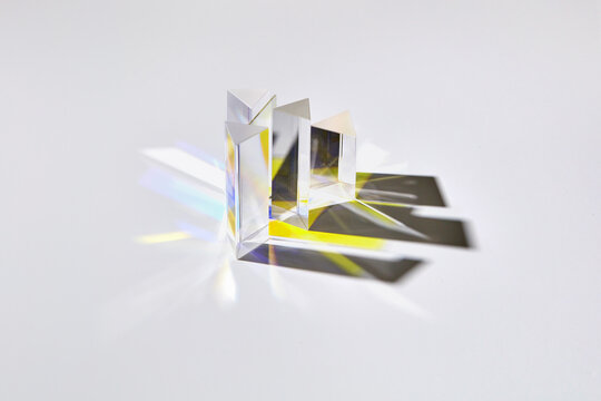 Clear glass prisms with reflection and shadows.