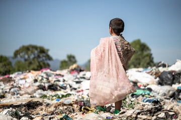 Poor children collect garbage for sale because of poverty, Junk recycle, Child labor, Poverty concept, human trafficking, World Environment Day, - obrazy, fototapety, plakaty