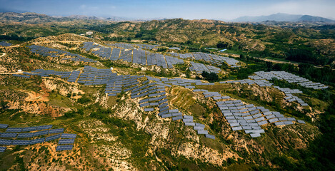 Fototapeta na wymiar Solar photovoltaic base built by aerial photography mountain