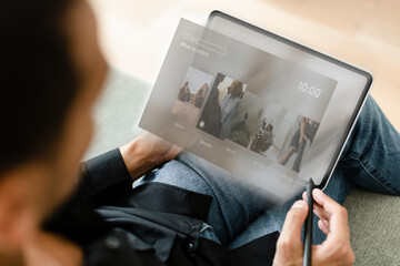 Man using digital tablet with stylus