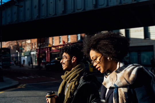Young Black Couple Walking Downtown