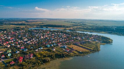 European village, river, forest. Aerial view.