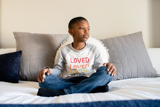 Boy on bed looking away