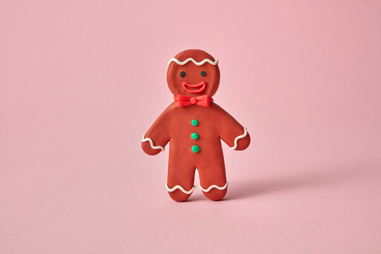 Smiling figure of Gingerbread man made from plasticine.
