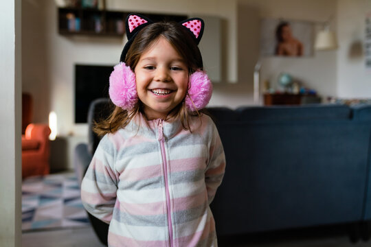 Cute girl in pajama and cat ears
