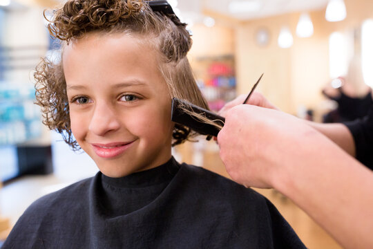 Smiling Boy Gets Hair Cut