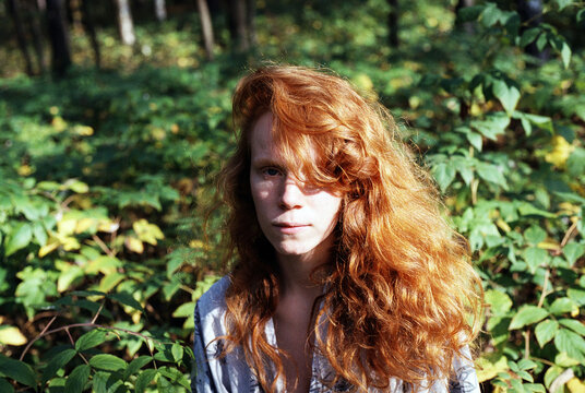 Redhead girl in forest
