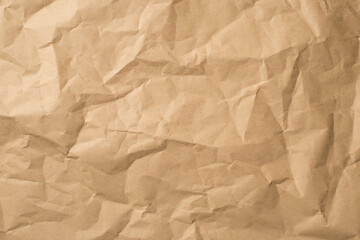 Top view photo of isolated beige crumpled craft paper background with copyspace