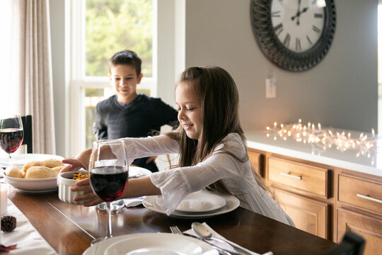 Thanksgiving: Girl Puts Cranberry Sauce On Table