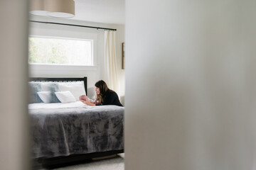 Reflection of mother holding newborn