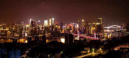Night view of high-rise buildings beside the Yangtze River in Chongqing