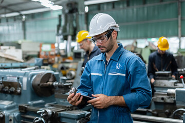 Teamwork professional engineer working heavy industry in factory, engineering wear uniform...