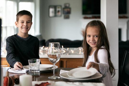 Thanksgiving: Kids Getting Ready For Dinner And Looking At Camer
