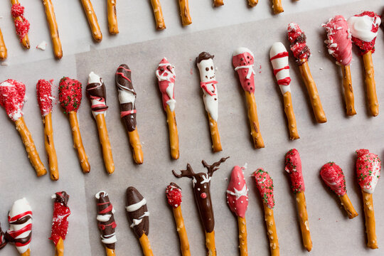 Rows of chocolate dipped Christmas Pretzels
