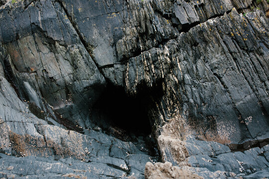 A heart-shaped cave in a cliff.
