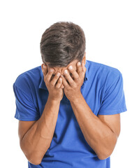 Portrait of stressed young man on white background