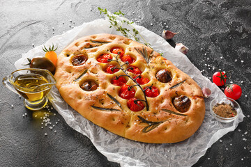 Composition with traditional Italian focaccia on dark background