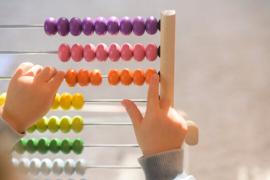 Child counting beads