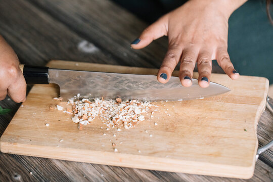 Anonymous Woman Cutting Fresh Onion For Handmade Dolmadakia