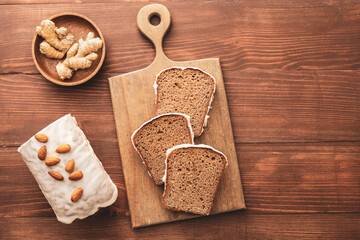 Composition with tasty gingerbread cake on wooden background