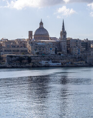 Fototapeta na wymiar Sea view of Valletta city - the capital of Malta with Basilica of Our Lady of Mount Carmel in Valletta, Malta.