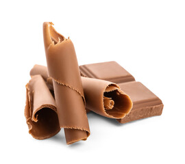 Delicious chocolate curls and pieces on white background