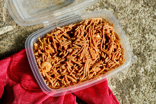 spanish fideua in a plastic container