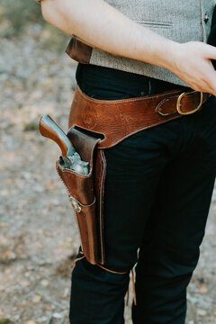 close up of a cowboy wearing gun