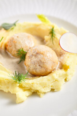 Mashed potatoes and rabbit cutlets. Restaurant food plate on white table. Delicious, healthy, organic dinner concept.