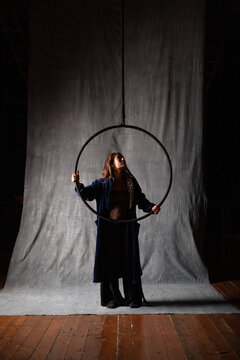 aerialist performer checks her hoop