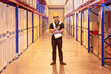 Portrait of Asian Warehouse Worker Standing with Holding Bar Code Scanner in Storage Warehouse....