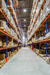 Interior of a modern warehouse storage of retail shop with pallet truck near shelves