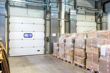 General view to the loading gates in the big distribution warehouse inside