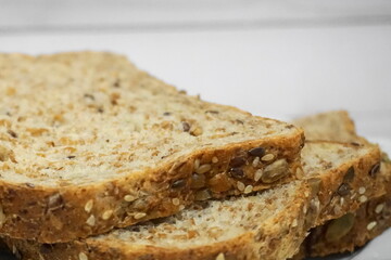 Sprouted Whole Grains Sliced Bread close up. Healthy eating concept.
