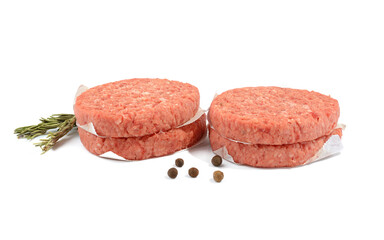 Raw beef patties for making a burger.Isolated on a white background.Selective Focus.