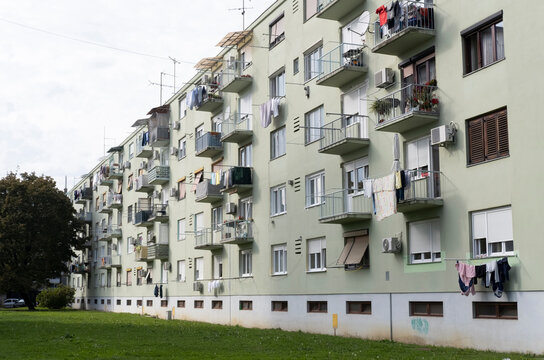 Light Green Residential Building With Balconies