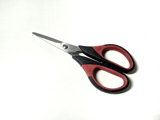 small scissors that have been used frequently and the paint is peeling off