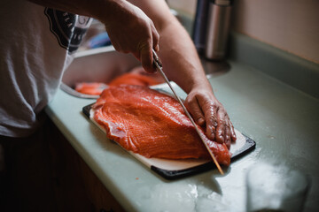 Man filleting fresh caught salmon