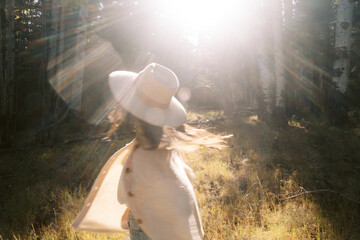 Woman spinning in sunlight