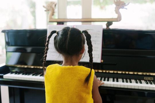Kid playing the piano
