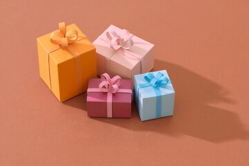 Handcraft gift box and christmas tree isolated on color background