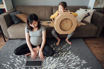 Pregnant woman working from home