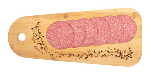 Slices of smoked sausage salami on a wooden serving tray