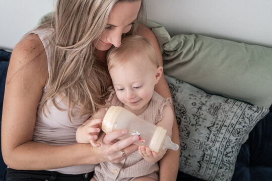 Baby Smiling At Breastmilk Bottle