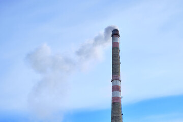 Industrial landscape, pipes with smoke. Air pollution by smoke paths