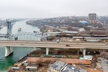 Aerial view on river Don and Temernitskiy bridge in Rostov-on-Don, Russia, in snowless winter with dreary overcast weather