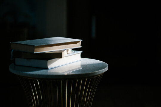 A sunlit stack of books