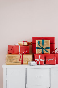 Stack of Christmas gifts on cupboard