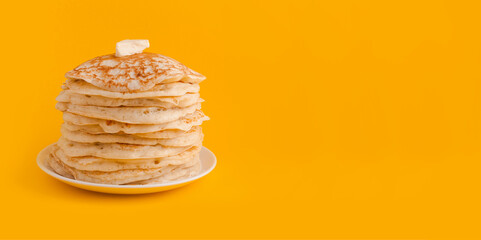 Staple of yeast pancakes with butter. Spring holiday Traditional Russian pancake week. isolated on...