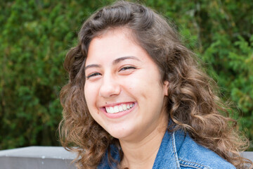 Amazing beautiful curly brown woman with perfect smile